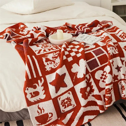 Cozy red and white decorbites knitted blanket throws featuring soft textured knit with stars coffee cups and chinese characters