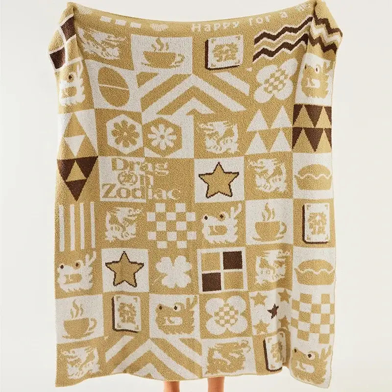A cozy beige and brown decorbites knitted blanket throws featuring red and white dragon zodiac designs for bedroom decor
