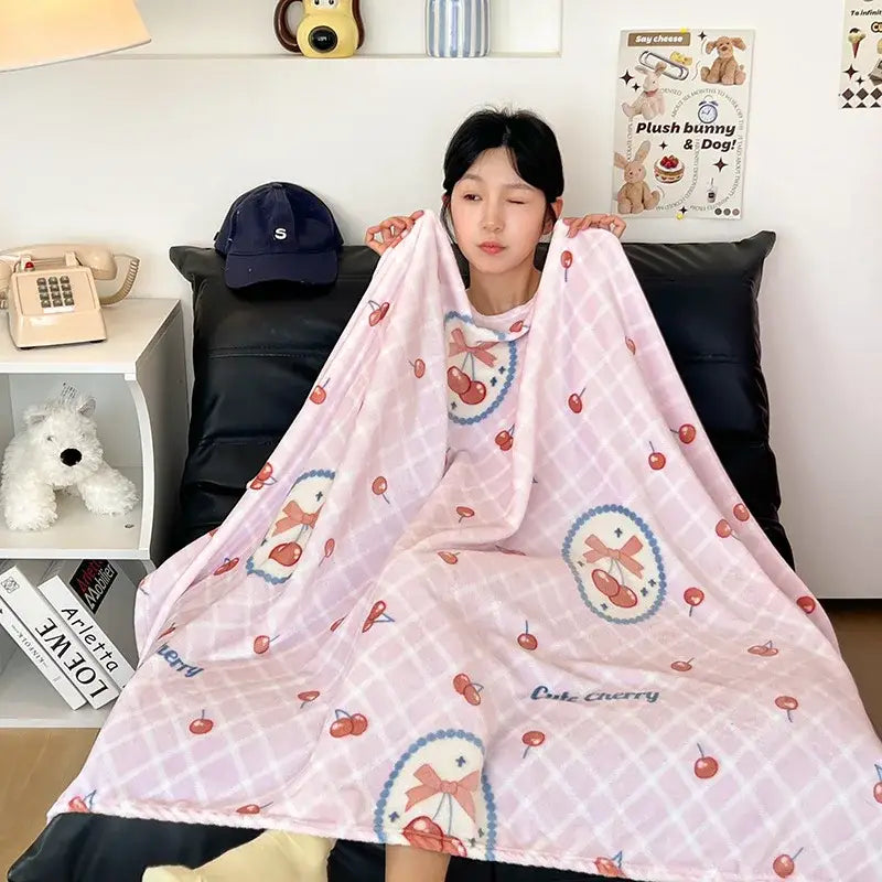 Pink cherry-patterned velvet printed blanket with soft cozy texture and subtle grid design for bedroom decor