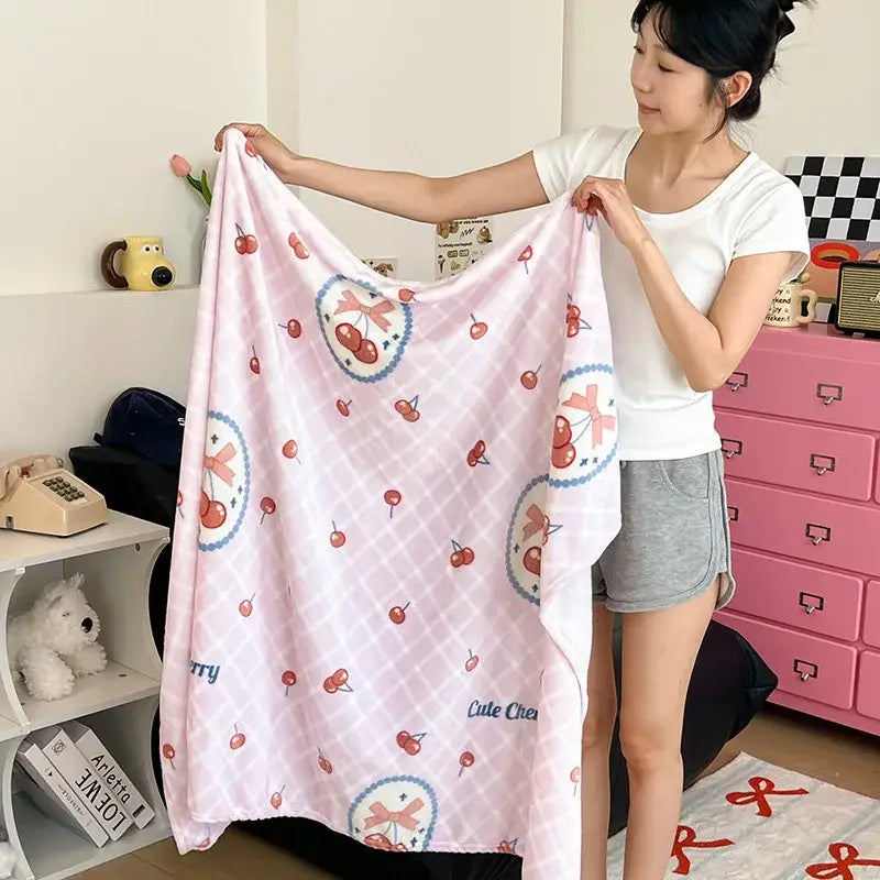 Pink cherry-patterned fleece velvet printed blanket with soft texture and cute circular designs for bedroom decor
