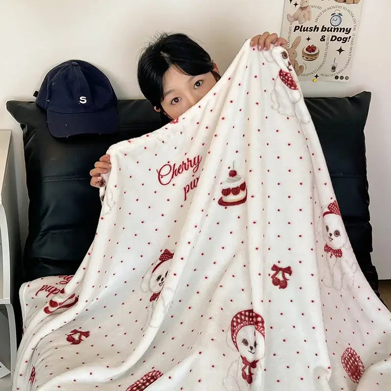 Red and white velvet printed blanket with plush texture and embroidered cherry-themed cartoon bunnies for bedroom decor