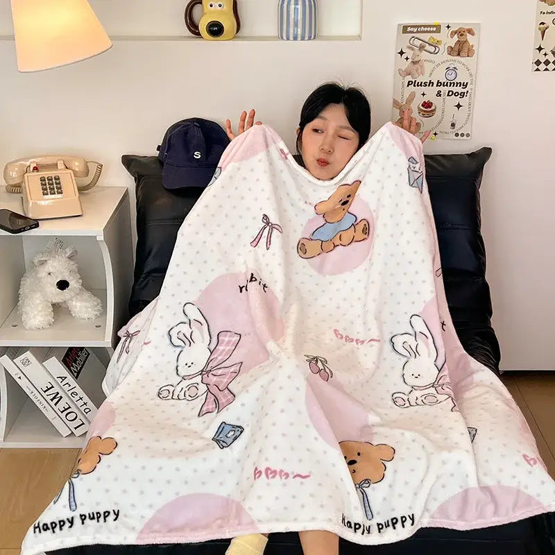 A soft pink and white velvet printed blanket with cute bunnies and bears perfect for bedroom decor