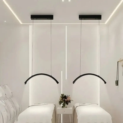 Black arched refined modern led pendant light with sleek minimalist design for beauty studio ceiling installation