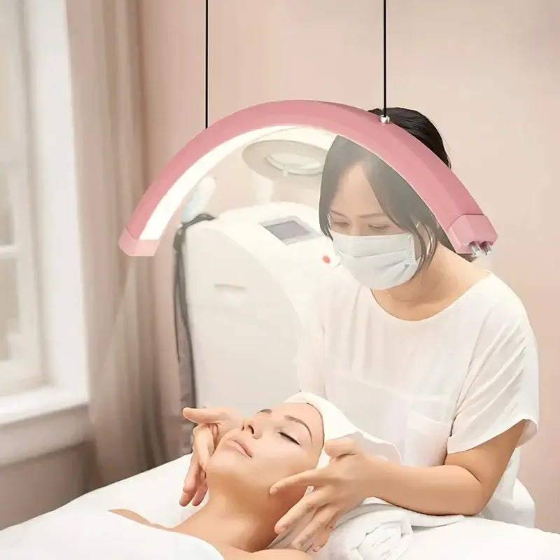 Refined modern pink arched led pendant light fixture designed for beauty studio with sleek contemporary design