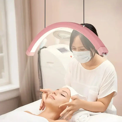 Refined modern pink arched led pendant light fixture designed for beauty studio with sleek contemporary design