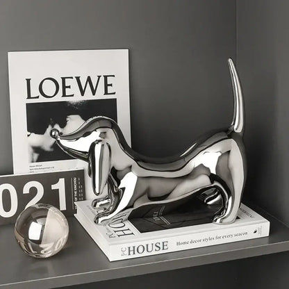 Shiny chrome-plated decorbites doberman art statue in reflective silver perfect for modern home decor