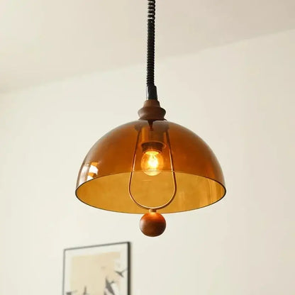Retro amber glass pendant light with warm amber shades, rustic metal fixture, and wooden accent for dining room decorbites amber shades