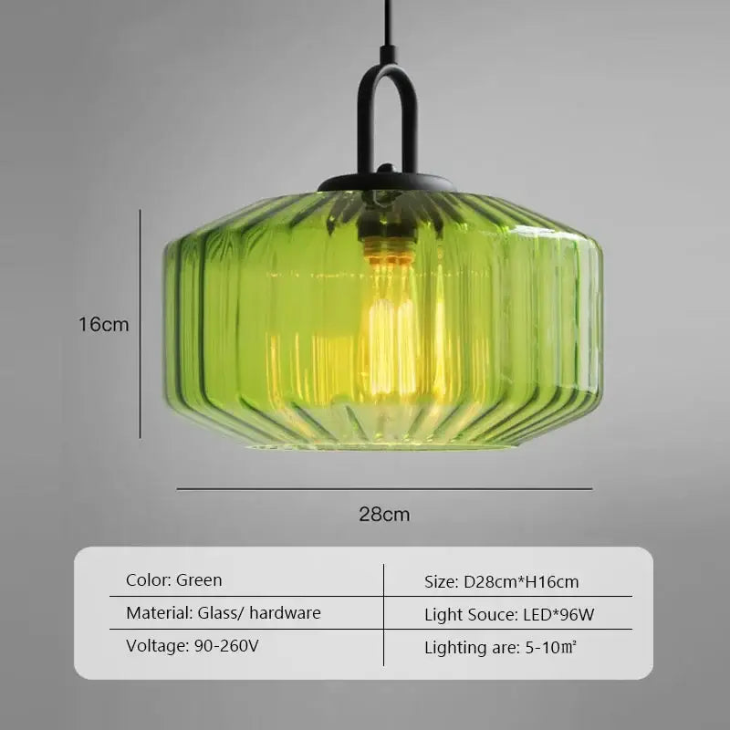 A vibrant green ribbed glass dining chandelier with black metal fixture from decorbites color glass collection