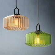 Two hanging pendant lights with amber and green ribbed color glass shades in black metal for dining chandelier decorbites color glass