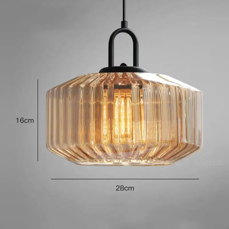 A warm amber glass dining chandelier with vertical ridges and black metal fixture from decorbites color glass collection