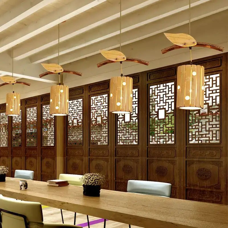Natural bamboo art chandelier featuring leaf-shaped warm-toned shades in wood for dining room pendant lighting