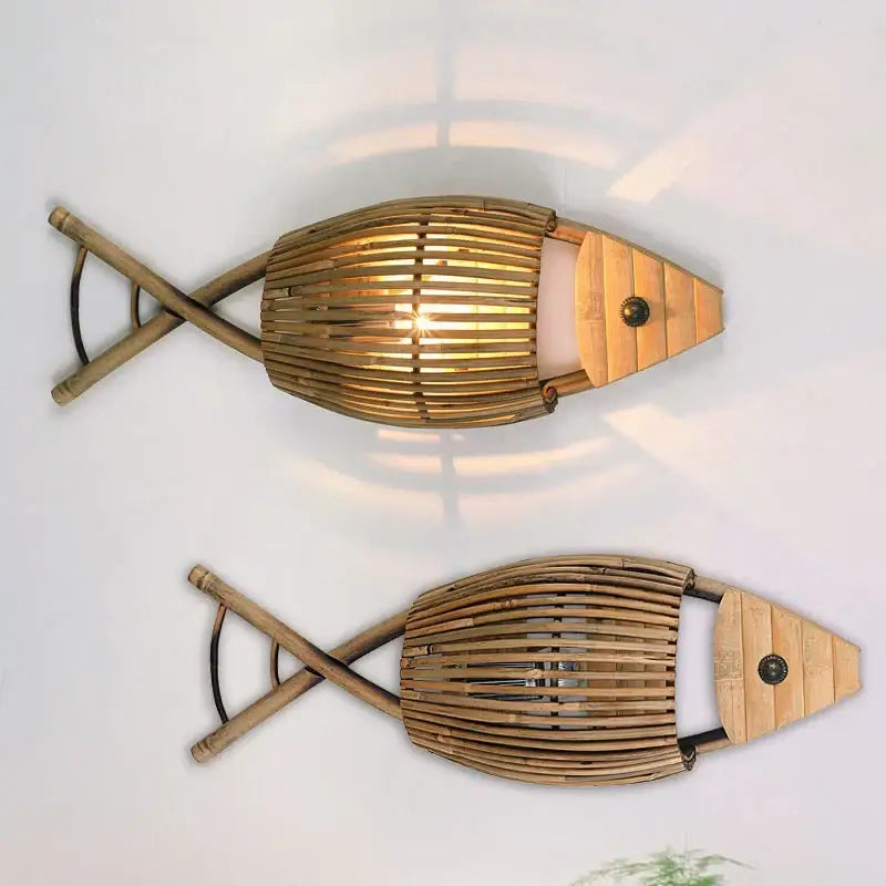 Two rustic bamboo fish wall lamps with warm glowing interiors and natural wood accents for living room decorbites bamboo fish decor