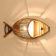 A warm-toned bamboo fish wall lamp with slatted design and decorative knob for retro living room decorbites bamboo fish