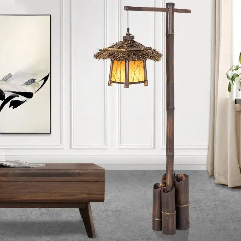 Rustic bamboo weave floor lamp with thatched roof and warm amber glass shade for zen living room light