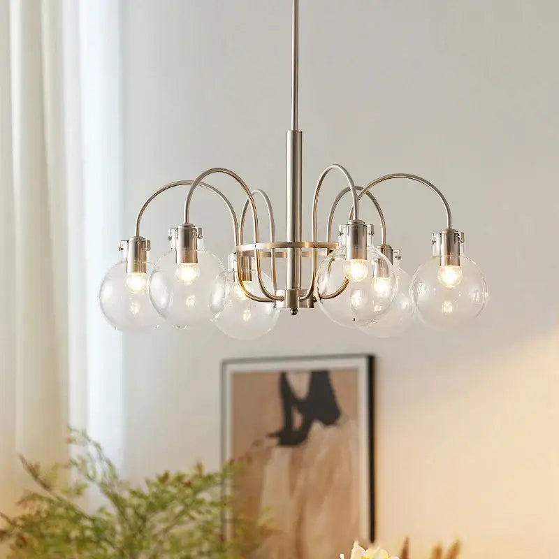 Modern brushed nickel retro bauhaus glass led chandelier with six clear globe bulbs and curved metal arms for dining room