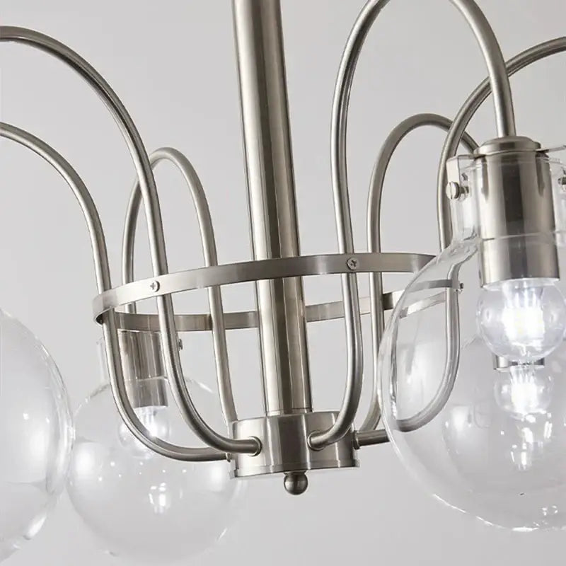 Stylish retro bauhaus brass glass led chandelier with brushed nickel curved metal arms and clear glass globe shades for dining room