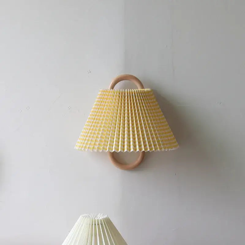 Retro beech wood wall lamp with yellow and white striped pleated cream shade mounted on wooden ring