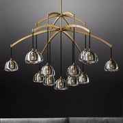 Gold-toned decorbites black brass retro chandelier with clear glass pendant shades and exposed filament bulbs for dining room decor