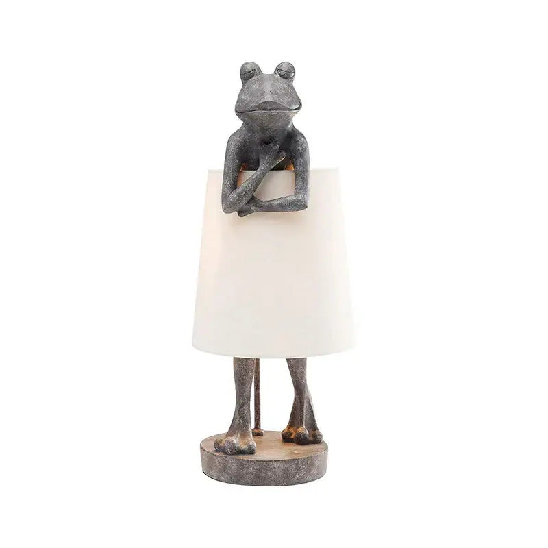 Retro black decorbites frog resin desk lamp with a whimsical gray frog base and white conical shade for bedroom lighting