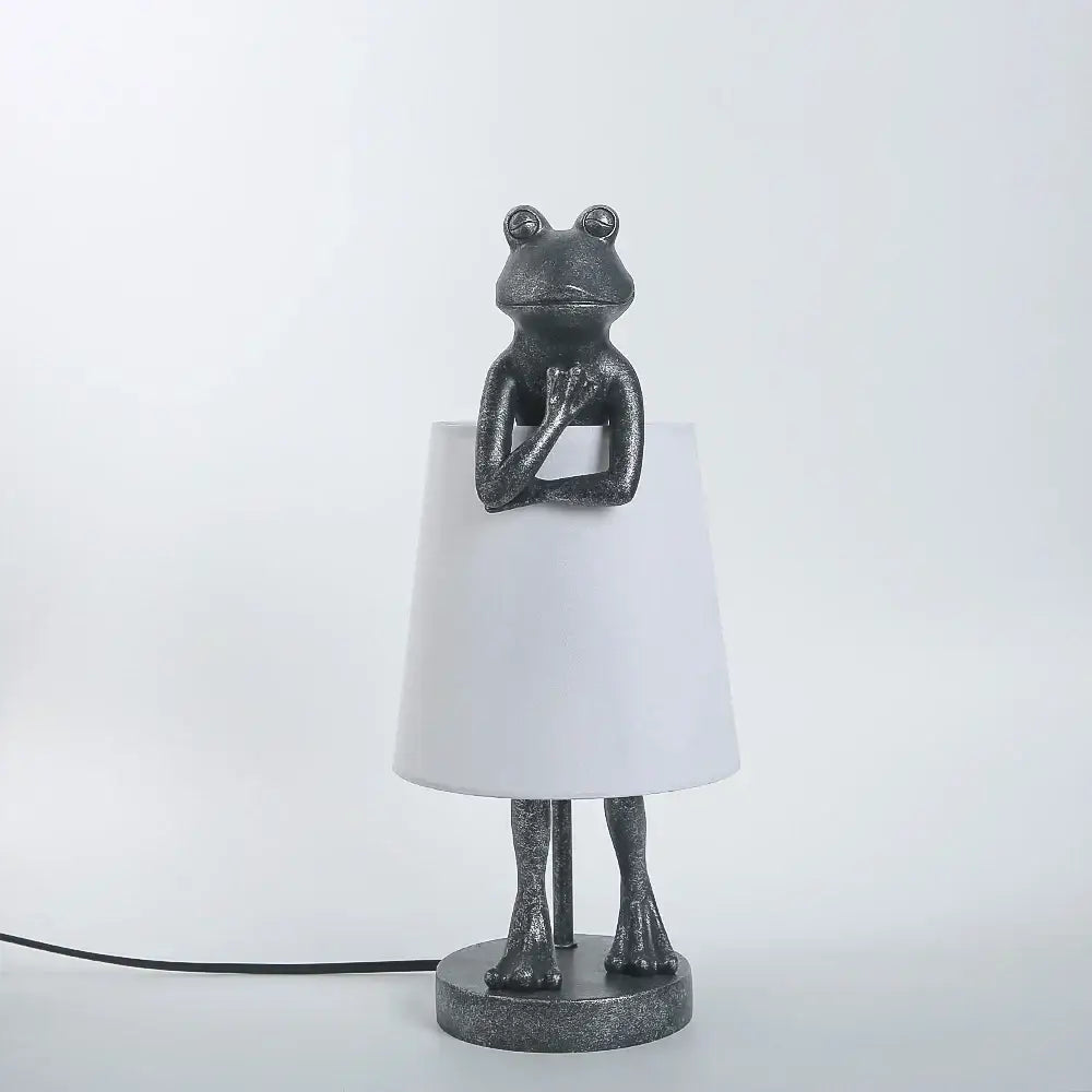 Retro black frog resin desk lamp features a dark gray textured frog base with a white lampshade for bedroom lighting decorbites frog resin