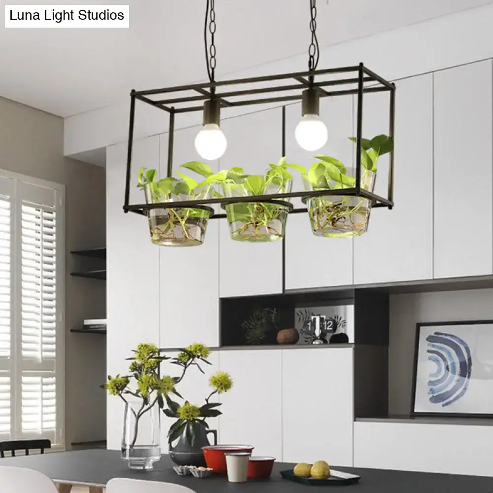 Black metal rectangle island ceiling light with three clear glass planters and two exposed bulbs for dining room use