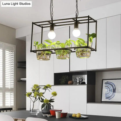 Black metal rectangle island ceiling light with three clear glass planters and two exposed bulbs for dining room use