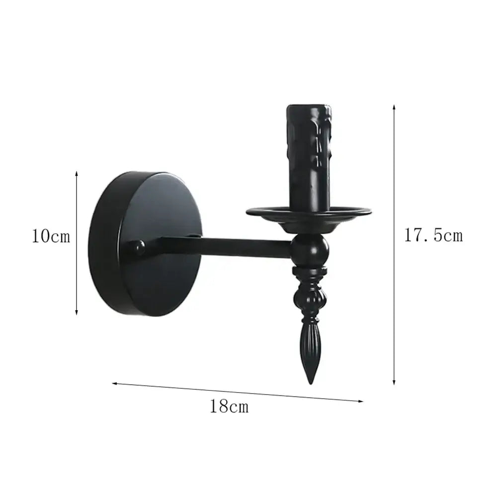 Black wrought iron art wall lamp with ornate candle-style design and decorative base for retro living room decorbites iron art