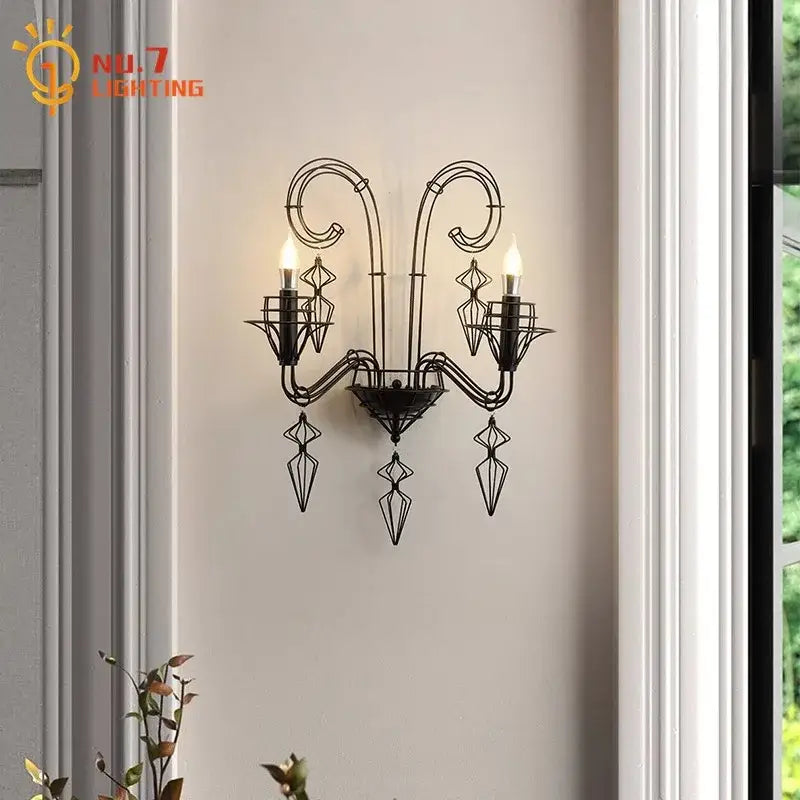 Retro black iron candle wall lamp with ornate scrollwork and three candle bulbs for living room wall lamp use