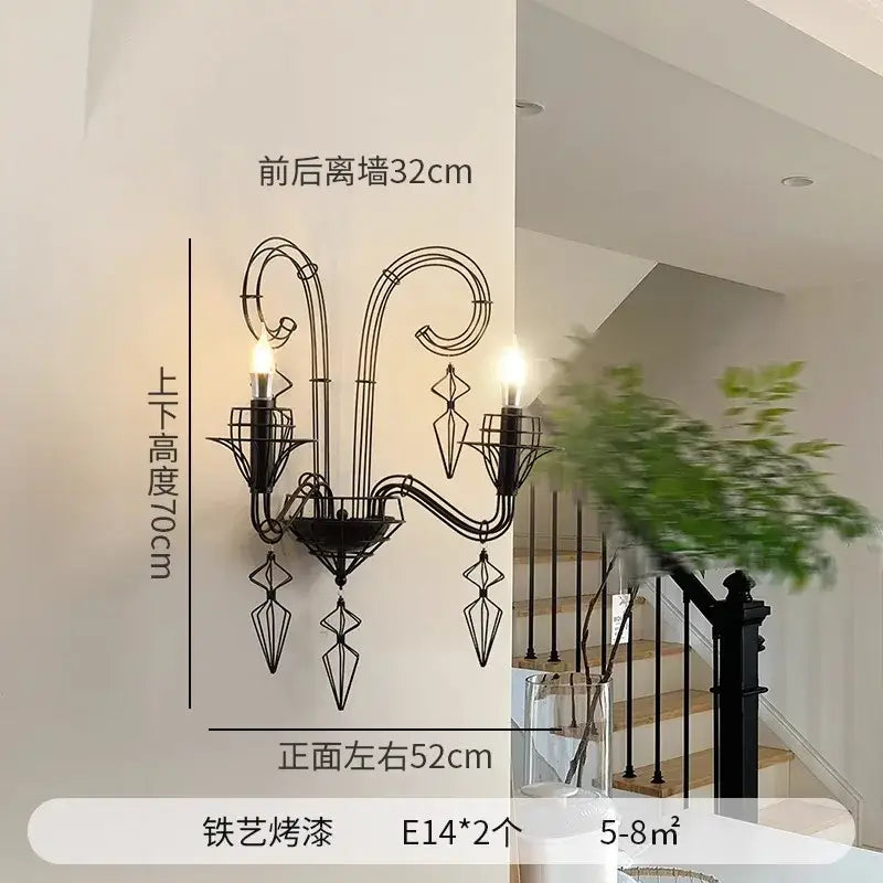 Retro black iron candle wall lamp with two lit e14 bulbs and decorative crystal elements for living room wall lamp