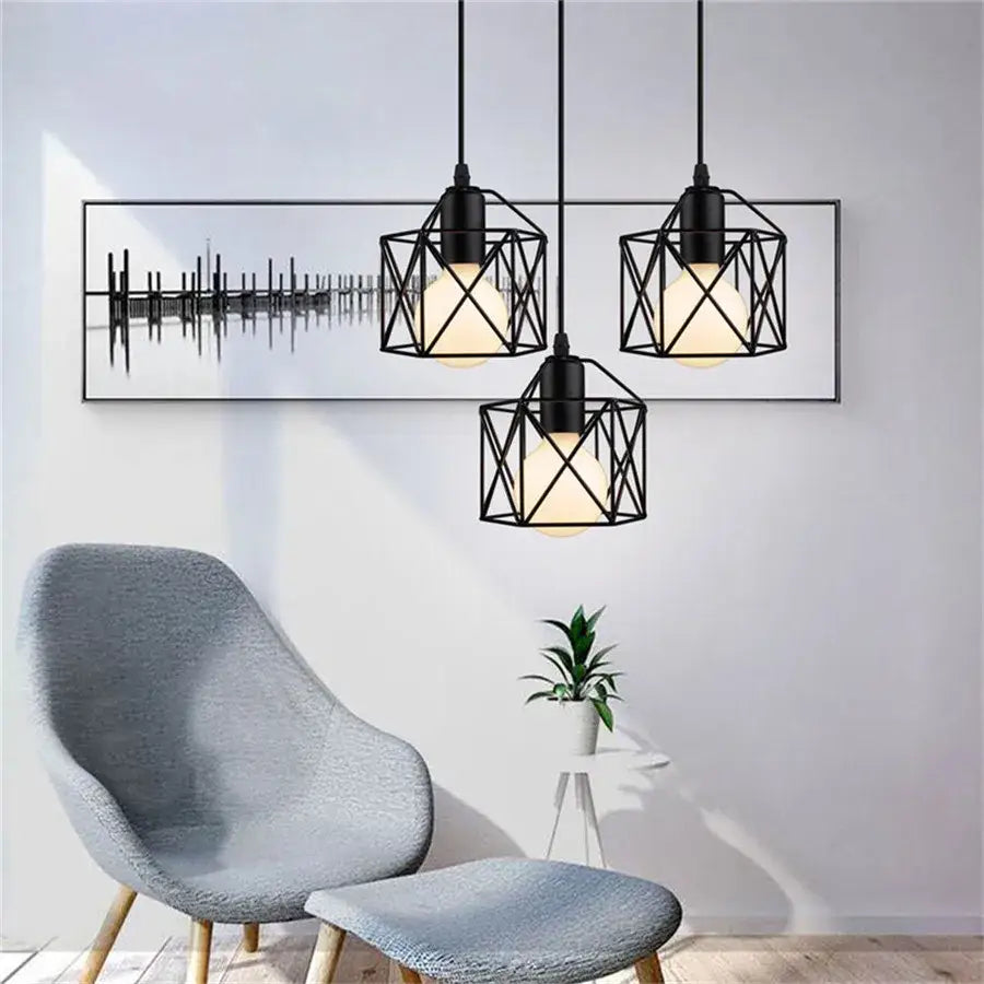 Retro black iron frame pendant light with geometric cage design and warm glowing bulbs for kitchen decorbites iron frame