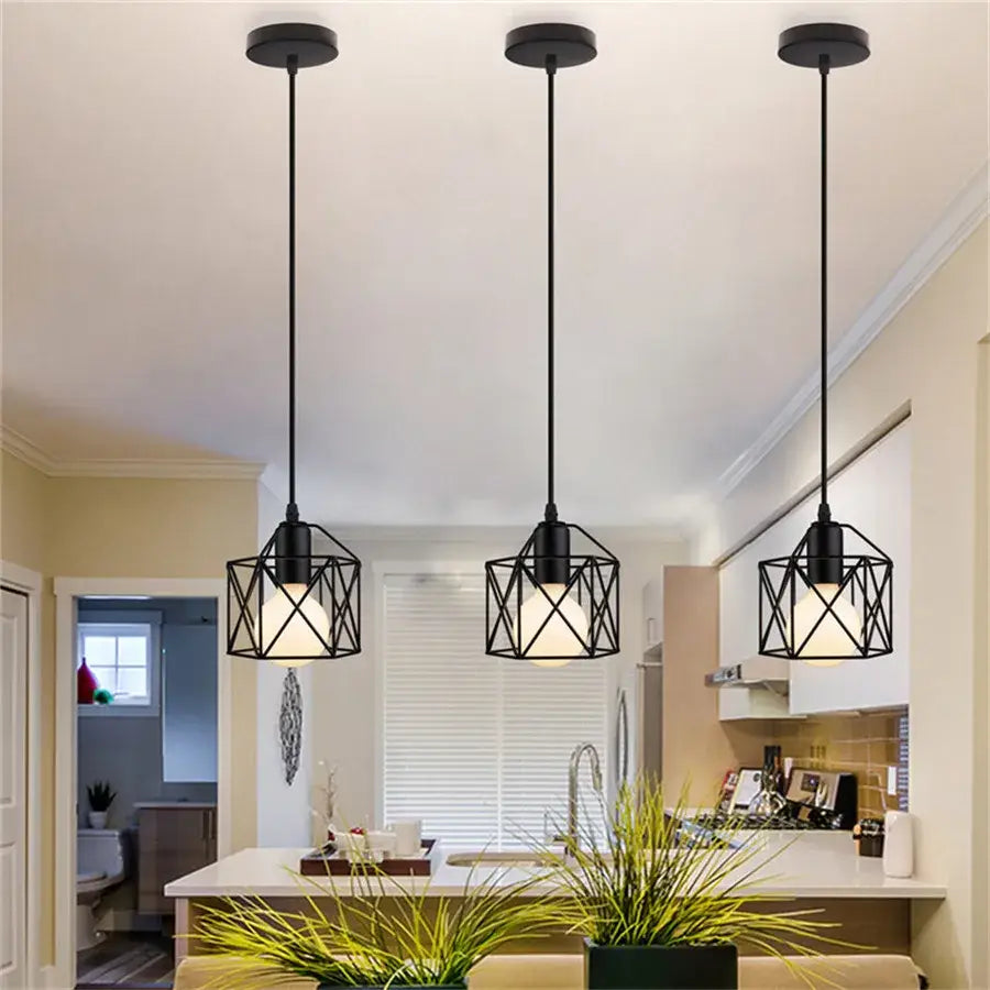 Three black geometric iron frame pendant lights with a modern industrial design ideal for kitchen decorbites iron frame