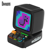 Retro black ditoo pixel art bluetooth speaker with vibrant purple teal pixelated screen and colorful illuminated keys