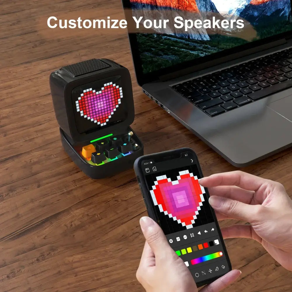 Black ditoo pixel art bluetooth speaker with pixelated heart display and customizable color via smartphone app