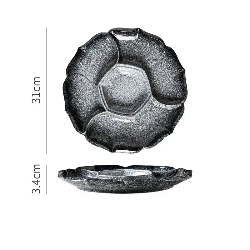 Retro black speckled decorbites ceramic dinner plate with petal rim and hexagonal center indentation for serving