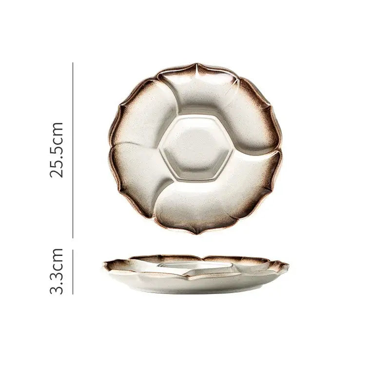Retro black speckled decorbites ceramic dinner plate with petal-like rim and central hexagonal indentation for serving