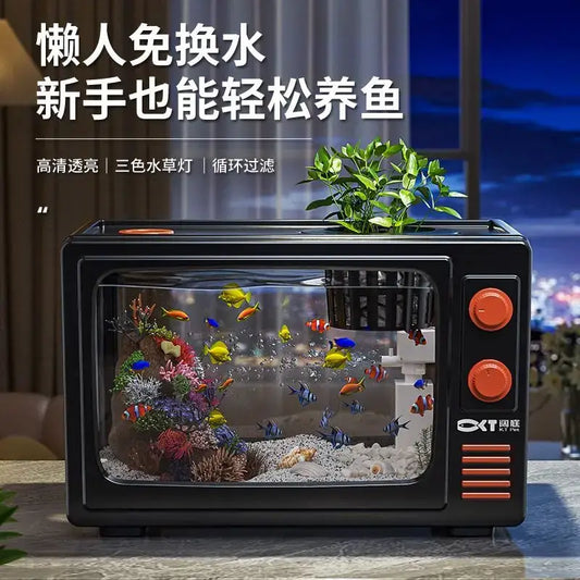 Retro black tv desktop fish tank with orange knobs and vents featuring colorful fish in a clear glass aquarium decorbites desktop fish