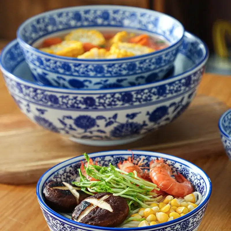 Stacked blue and white retro ceramic soup noodle bowls featuring intricate floral patterns for dining room use