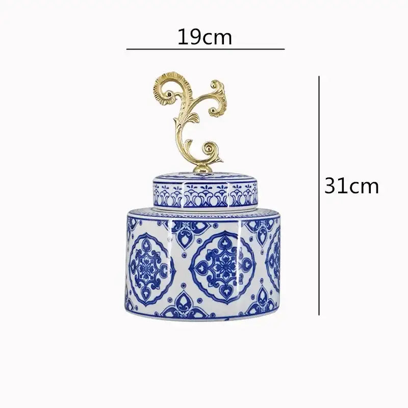 A tall porcelain covered vase jar with blue and white floral patterns and a gold-toned ornate lid for living room storage