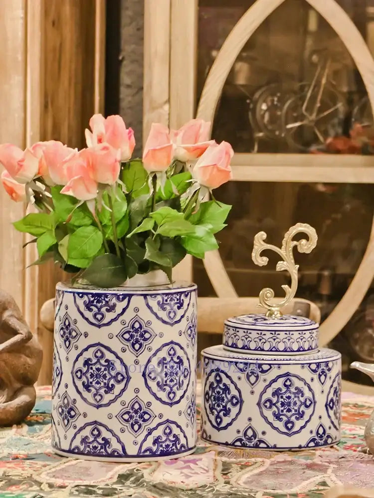 Retro blue and white patterned porcelain covered vase jar with ornate gold-toned lid for living room storage