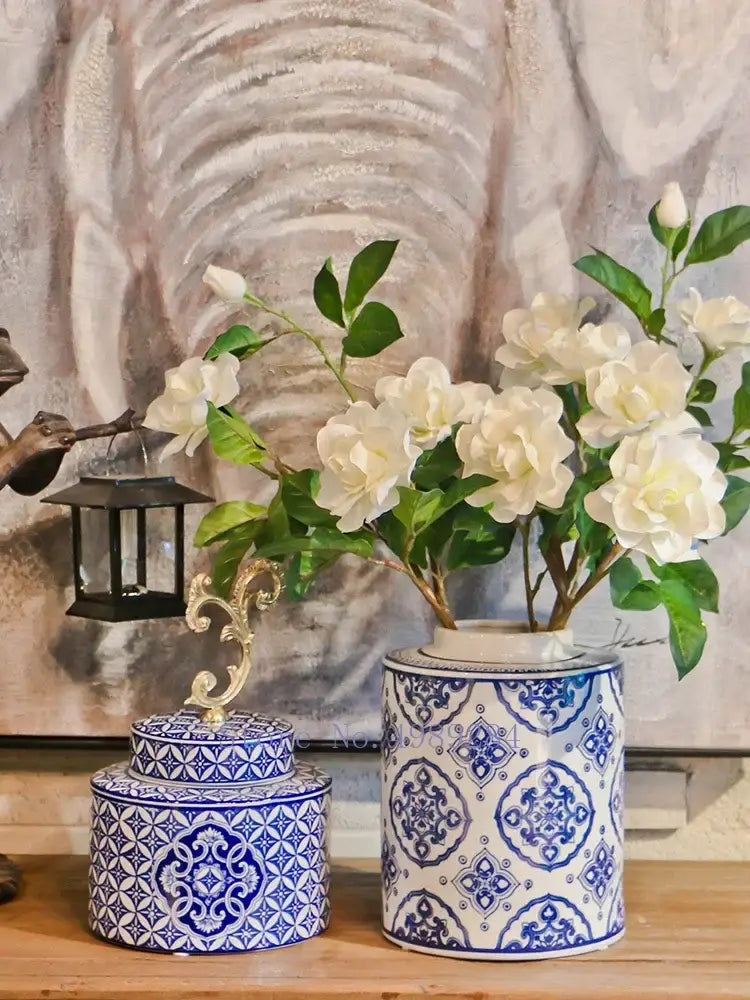 Retro blue and white porcelain covered vase jar with ornate gold accents for living room storage and decor