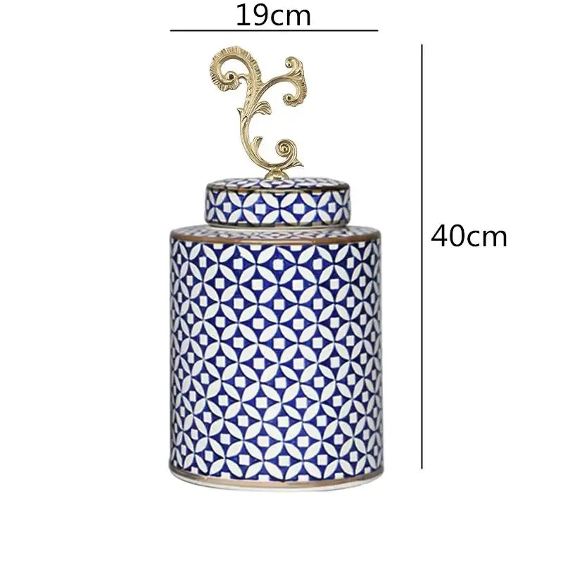 A tall porcelain covered vase jar with blue and white geometric patterns and a gold metal finial for living room storage