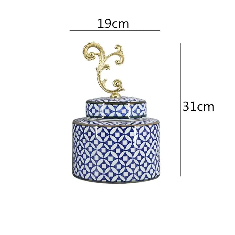A blue and white patterned porcelain covered vase jar with a gold-toned ornate lid for living room storage