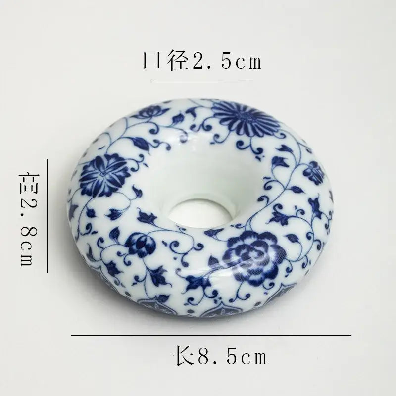 A white ceramic retro blue and white porcelain teacup tray set with intricate floral patterns for dining room decor