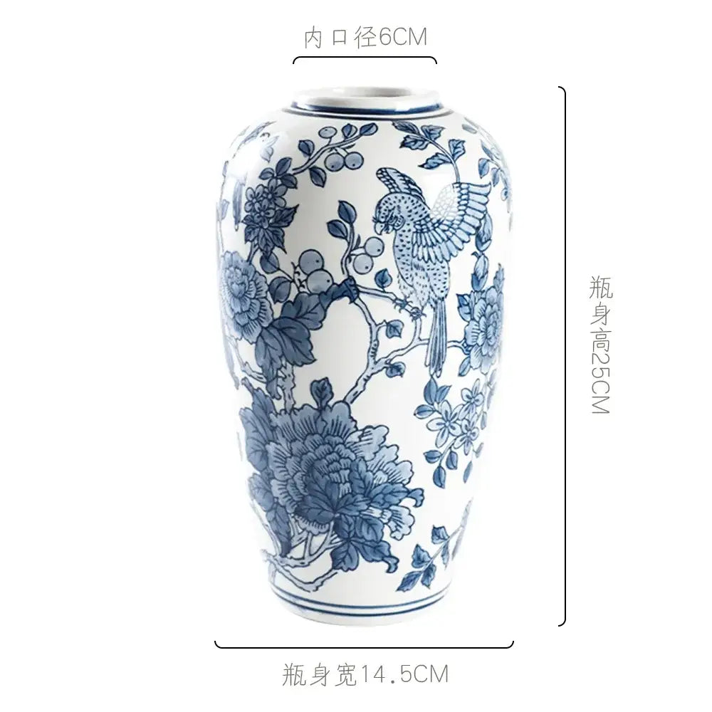 Retro blue and white porcelain vase featuring intricate hand-painted floral and bird designs for living room decorbites blue white decor
