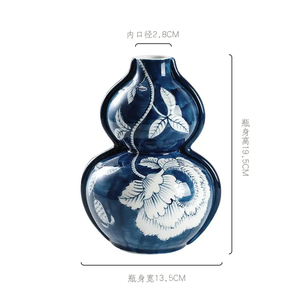 Retro blue and white porcelain vase in deep blue ceramic with intricate white floral and vine patterns for living room decorbites blue white