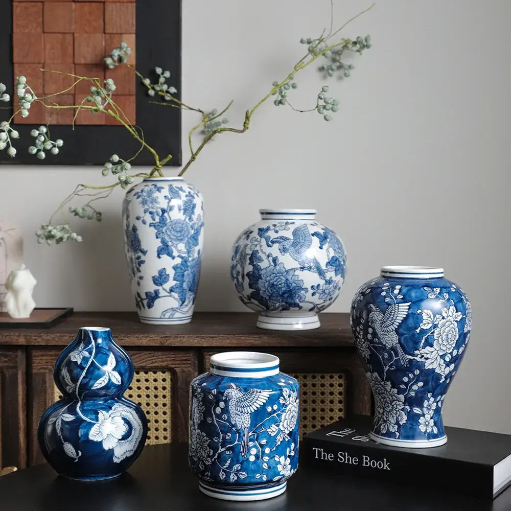 Retro blue and white porcelain vase featuring intricate floral and bird patterns as a living room decorbites blue white pot