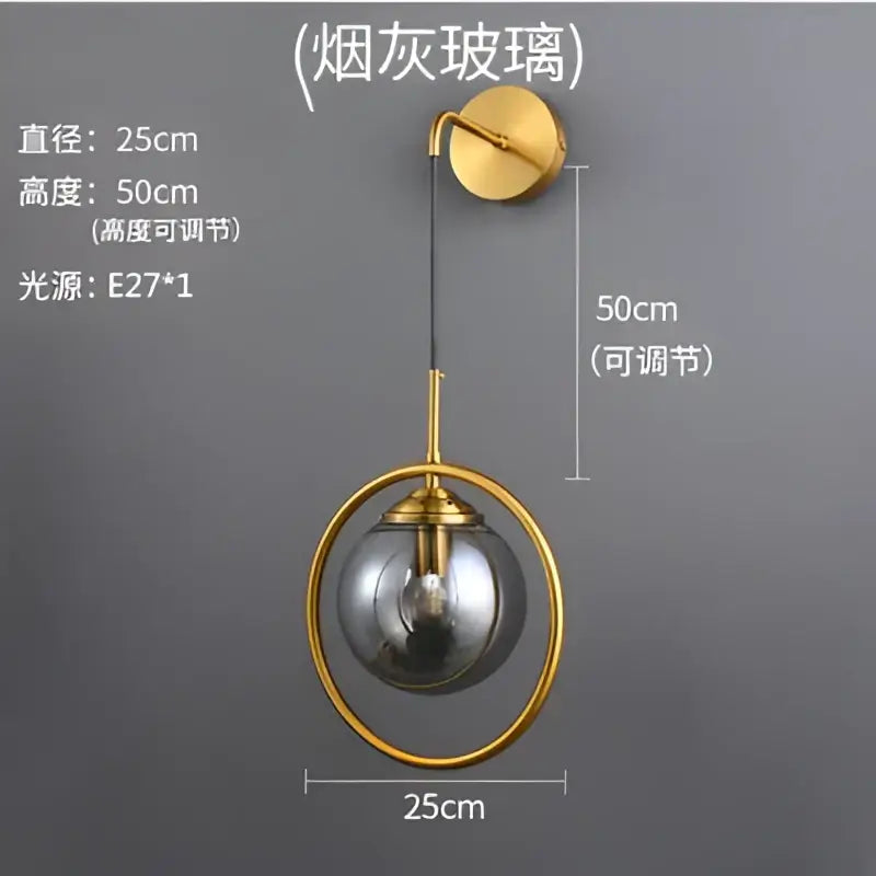 Gold-toned retro brass wall lamp with amber decorbites glass ball and smoked glass globe for bathroom sconce lighting
