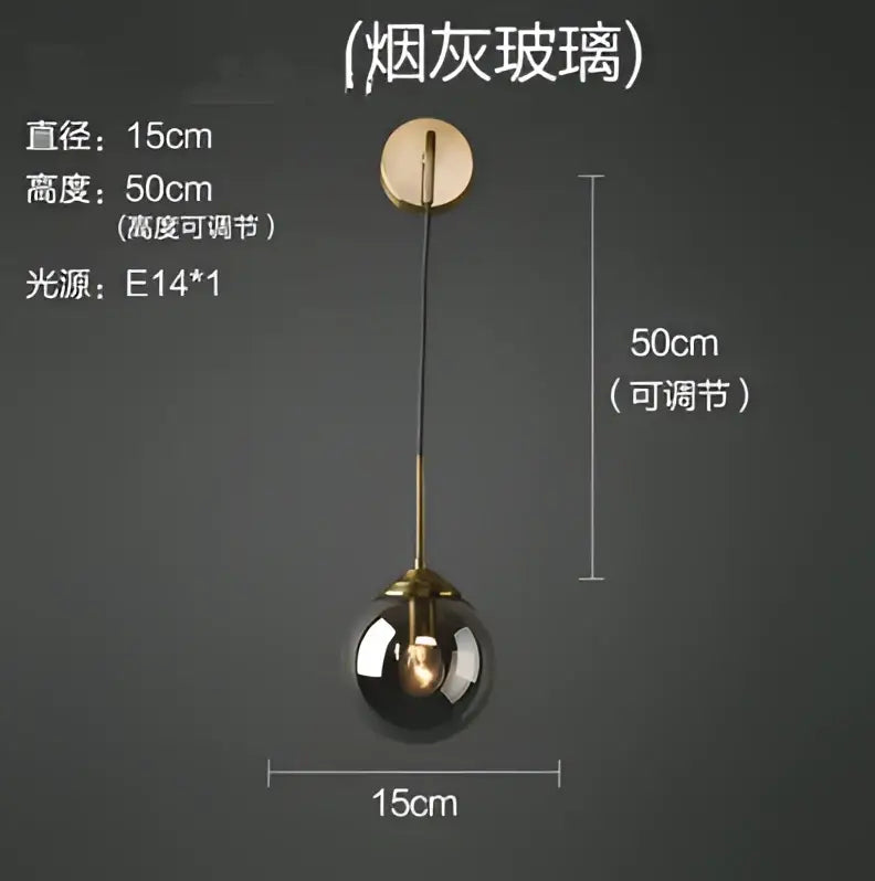 A sleek decorbites glass ball wall lamp with smoked glass globe and brass accents for stylish bathroom lighting