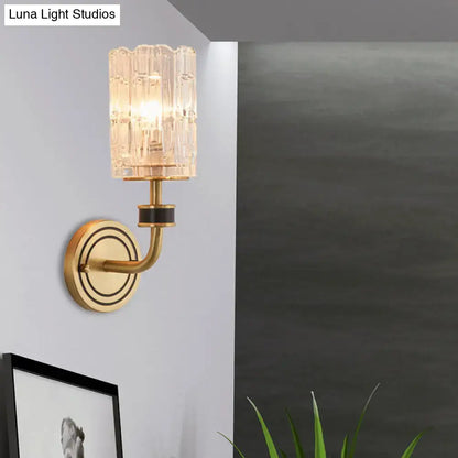 Gold-toned retro brass wall light with faceted translucent glass shade compatible with e12 e14 bulb base
