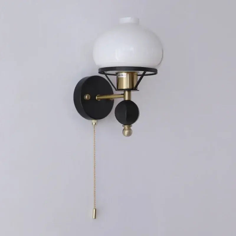 Black and brass wall lamp with white opal glass globe for decorbites french wall lamp bedroom globe light